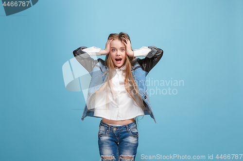 Image of Happy success teen girl celebrating being a winner. Dynamic energetic image of female model