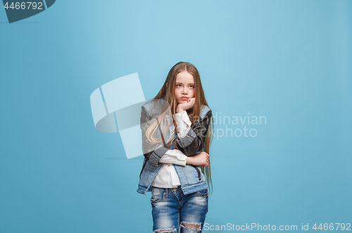 Image of Young serious thoughtful teen girl. Doubt concept.