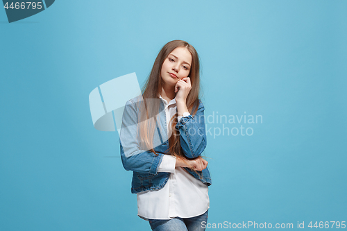 Image of Young serious thoughtful teen girl. Doubt concept.