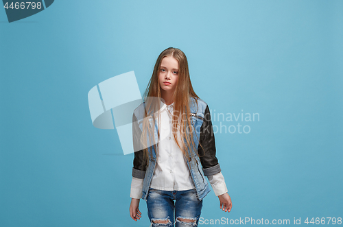 Image of Young serious thoughtful teen girl. Doubt concept.