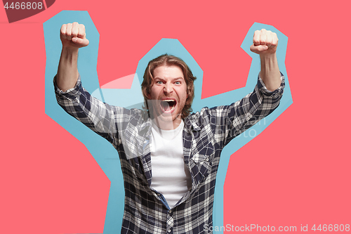 Image of Winning success man happy ecstatic celebrating being a winner. Dynamic energetic image of male model