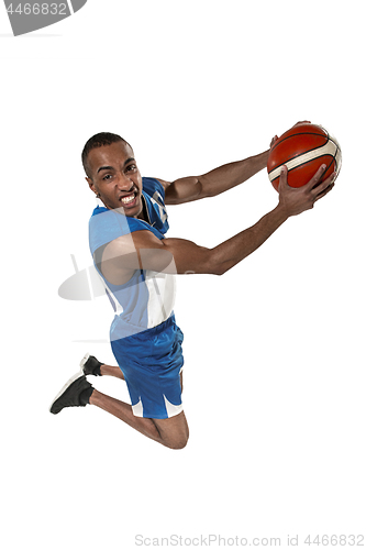 Image of Full length portrait of a basketball player with ball