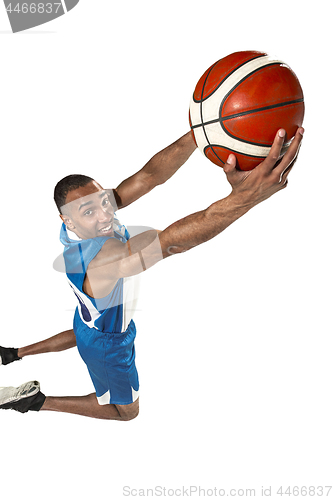 Image of Full length portrait of a basketball player with ball