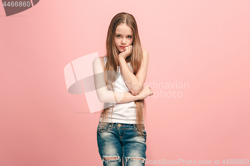 Image of Young serious thoughtful teen girl. Doubt concept.