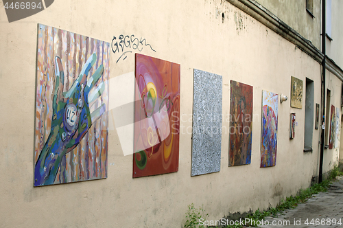 Image of LITHUANIA, VILNIUS - AUGUST 14, 2014 - Paintings on a street wall in Uzupis