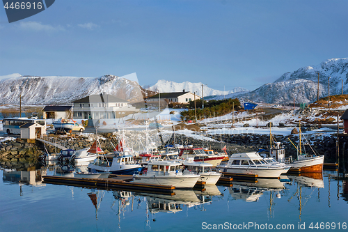 Image of Fishing boats and yachts on pier in Norway