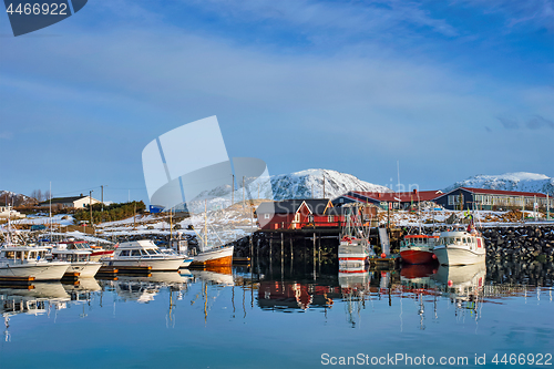 Image of Fishing boats and yachts on pier in Norway