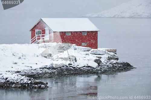 Image of Red rorbu house in winter, Lofoten islands, Norway