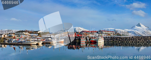 Image of Fishing boats and yachts on pier in Norway