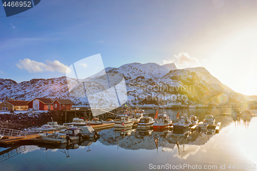 Image of Fishing boats and yachts on pier in Norway