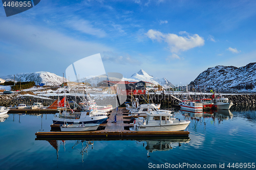 Image of Fishing boats and yachts on pier in Norway