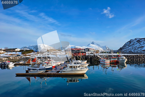 Image of Fishing boats and yachts on pier in Norway