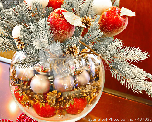 Image of Christmas holidays composition with red apples, silver balls, andglass vase