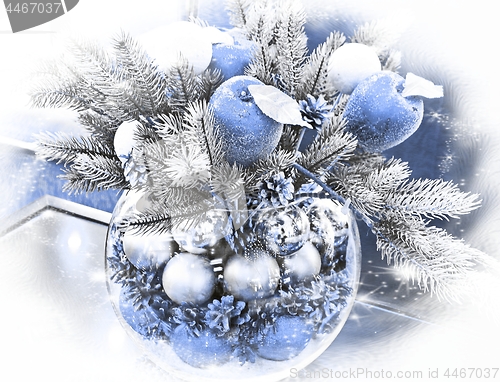 Image of Christmas holidays composition with blue apples and silver balls on white