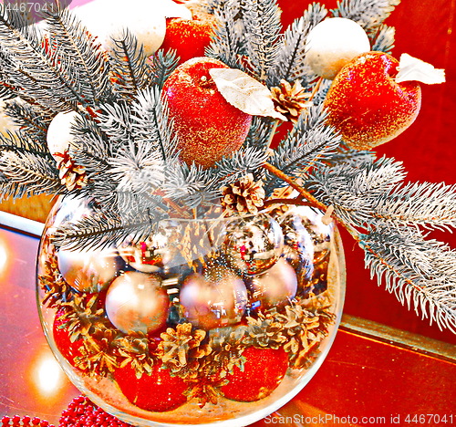 Image of Christmas holidays composition with red apples and glass vase