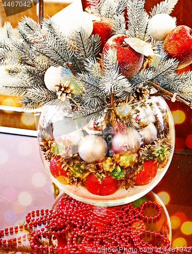 Image of Christmas holidays composition with red apples and glass vase