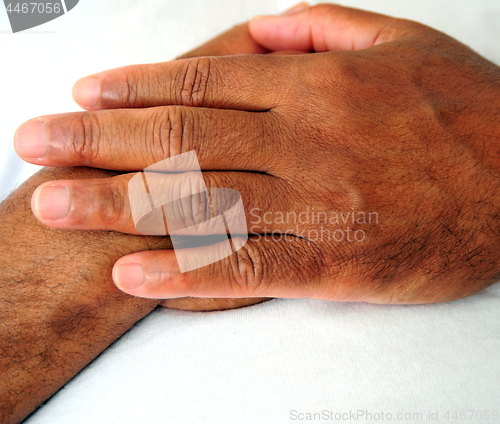 Image of African american hands resting.