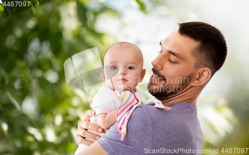 Image of father with little baby daughter