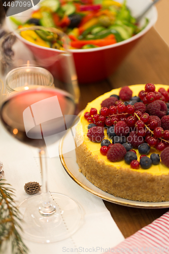 Image of close up of cake and other food on christmas table