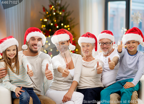 Image of happy family sitting on couch at home