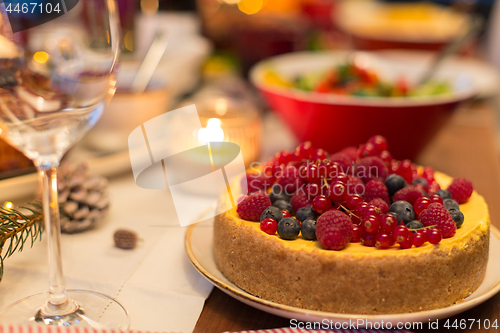 Image of close up of cake and other food on christmas table