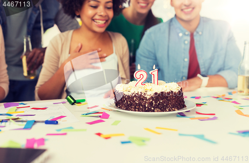 Image of team greeting coworker at office birthday party