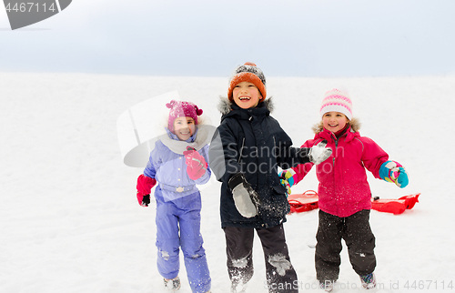 Image of happy little kids playing outdoors in winter