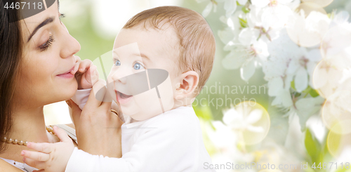 Image of mother with baby over cherry blossom background