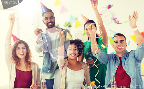 Image of happy team with confetti at office birthday party