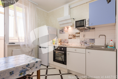 Image of The interior of a small kitchen in the apartment