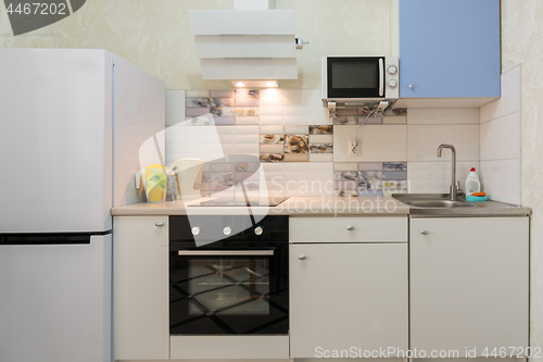 Image of The interior of a compact kitchen in the apartment house