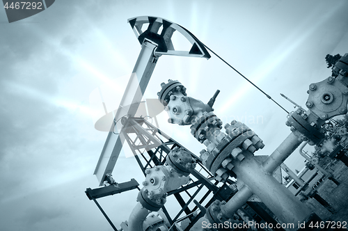 Image of Pump jack and oilwell.