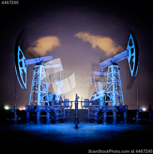 Image of Oil Rigs at night.