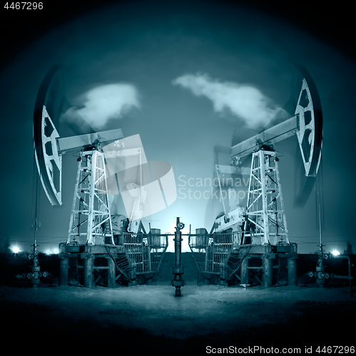 Image of Oil Rigs at night.