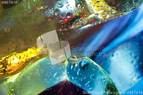 Image of Bright colorful abstract background. Glass and drops of water.