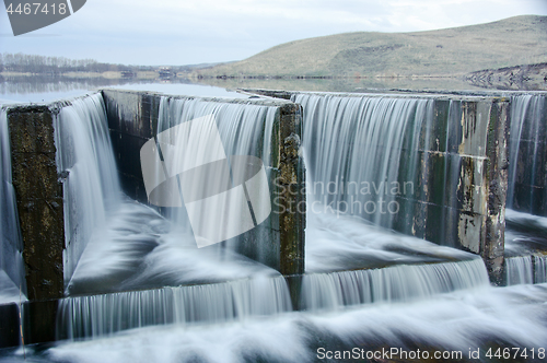 Image of water flowing over a dam