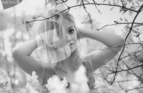 Image of Black And White Photo Of A Beautiful Young Woman In A Garden