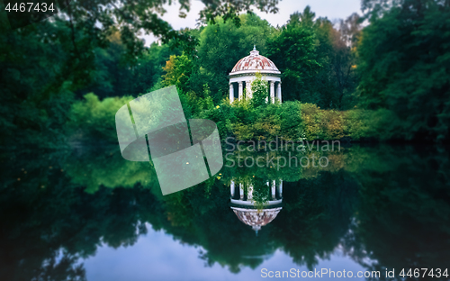 Image of White Gazebo Rotunda By The Pond In The Park