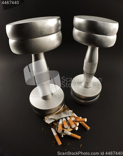 Image of cigarettes crushed Dumbbell