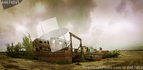 Image of Old broken ships on the coast.