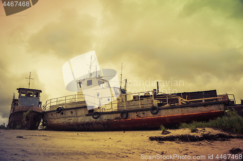 Image of Old broken ships on the coast.