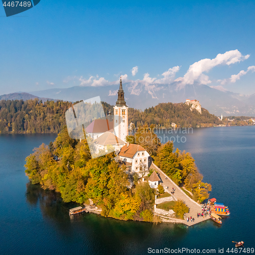 Image of Bled island on lake Bled, and Bled castle and mountains in background, Slovenia.