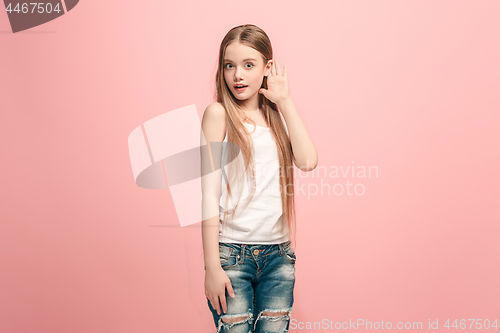 Image of The happy teel girl standing and listening