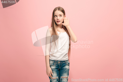 Image of The happy teel girl standing and listening