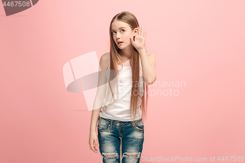 Image of The happy teel girl standing and listening