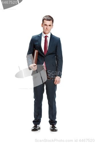 Image of Full body portrait of businessman with folder on white