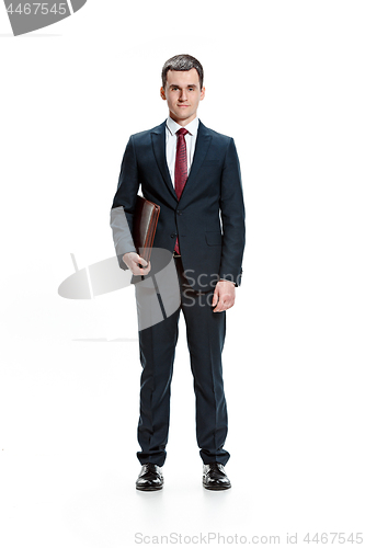 Image of Full body portrait of businessman with folder on white