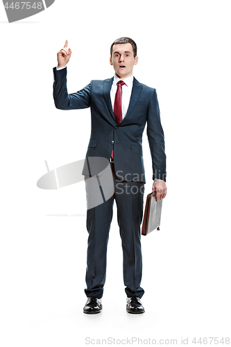 Image of Full body portrait of businessman with folder on white