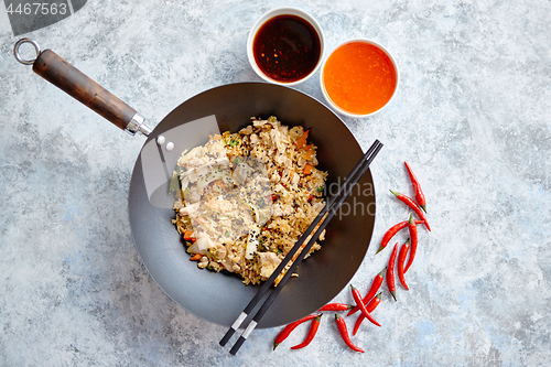 Image of Delicious fried rice with chicken in wok