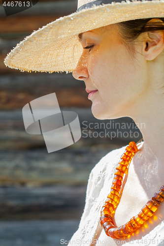 Image of woman with an amber necklace